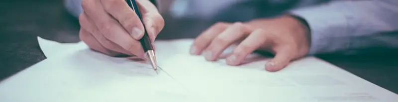 Signing the paperwork to sell a car in Missouri