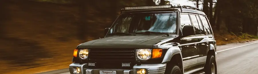 A high-mileage SUV still earning its keep on a forest road