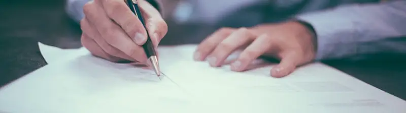 Signing the paperwork to sell a car in Missouri