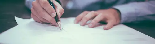 Signing the paperwork to sell a car in Missouri