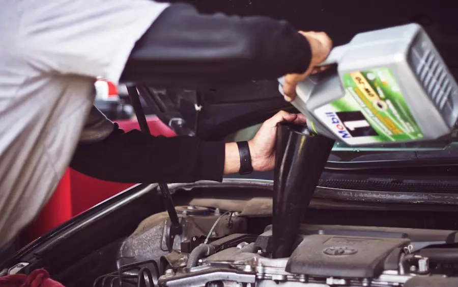 An appraiser checking under the hood of a car