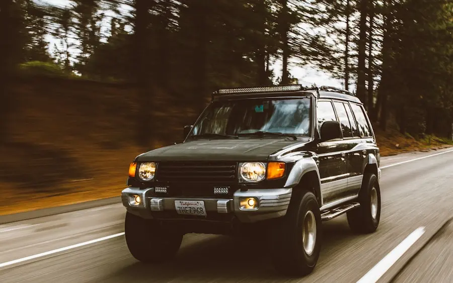 A high-mileage SUV still earning its keep on a forest road