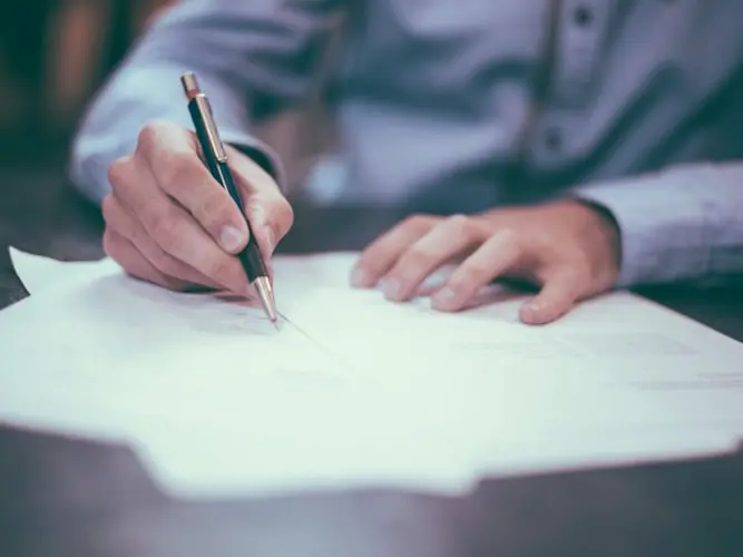 Working through the paperwork on a vehicle deal