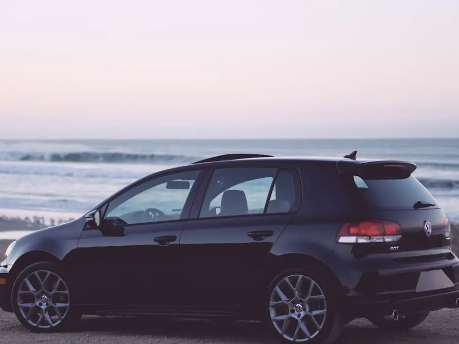 A car parked at the coast at dusk